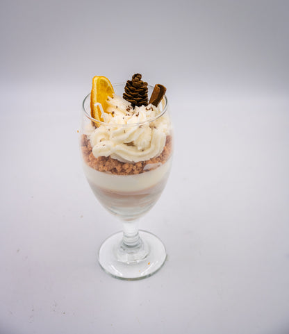 This beautifully crafted Macchiato&nbsp;parfait dessert is featured by&nbsp;foamed milk on espresso, layering on top with crumbled biscuit and whipped cream, garnished with a dried orange slice, a small pine cone, and a cinnamon stick, suggesting autumnal or winter seasonal flavors. Enjoy this lovely&nbsp;treat!
