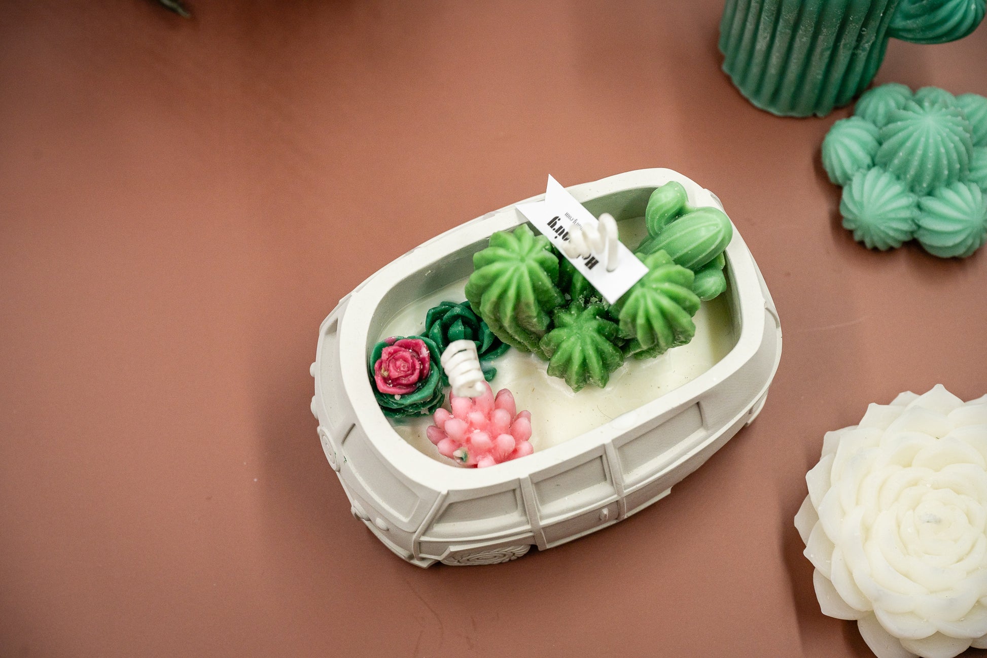 Scented Wax Melts Candle in Handmade Van/Bus-shaped Concrete Vessel with Succulent and Cactus, Double Cotton Wicks. 
Immerse yourself in this beautiful scented wax succulent and cactus garden thoughtfully crafted in the handmade van/bus-shaped candle vessel. A perfect decorative piece for any room, or a gift for plant lovers, housewarming, or any special occasions.