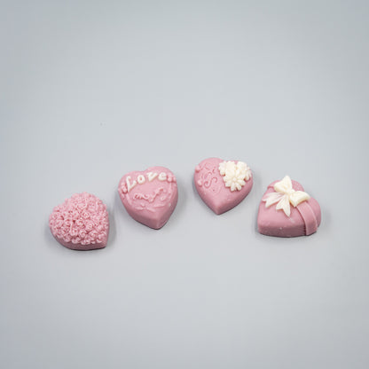 Indulge in a romantic home fragrance experience with this handcrafted collection of heart-shaped wax melts. Each set features four distinct, intricately detailed styles designed to bring elegance and charm to your space.

Four Unique Heart Styles:
Ribbon, Rose Bouque, "Kiss" with Flowers, "Love" with Ivy
