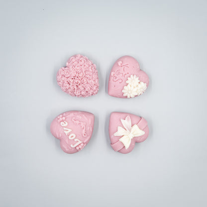 Indulge in a romantic home fragrance experience with this handcrafted collection of heart-shaped wax melts. Each set features four distinct, intricately detailed styles designed to bring elegance and charm to your space.

Four Unique Heart Styles:
Ribbon, Rose Bouque, "Kiss" with Flowers, "Love" with Ivy