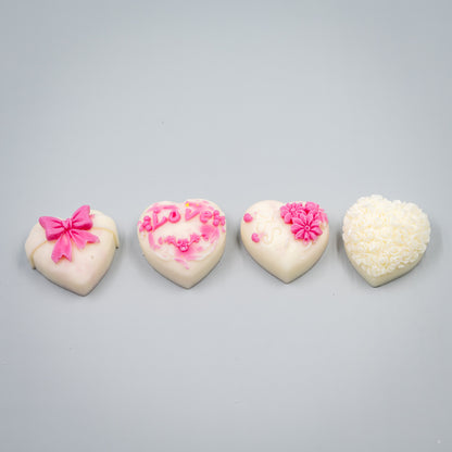 Indulge in a romantic home fragrance experience with this handcrafted collection of heart-shaped wax melts. Each set features four distinct, intricately detailed styles designed to bring elegance and charm to your space.

Four Unique Heart Styles:
Ribbon, Rose Bouque, "Kiss" with Flowers, "Love" with Ivy