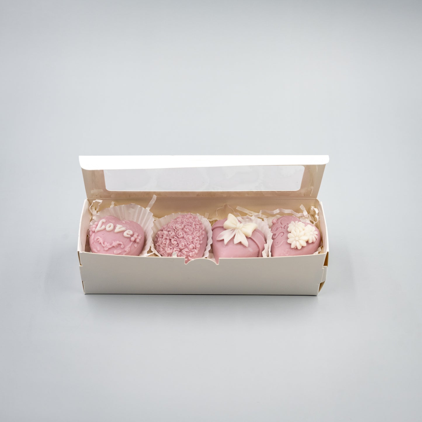 Indulge in a romantic home fragrance experience with this handcrafted collection of heart-shaped wax melts. Each set features four distinct, intricately detailed styles designed to bring elegance and charm to your space.

Four Unique Heart Styles:
Ribbon, Rose Bouque, "Kiss" with Flowers, "Love" with Ivy