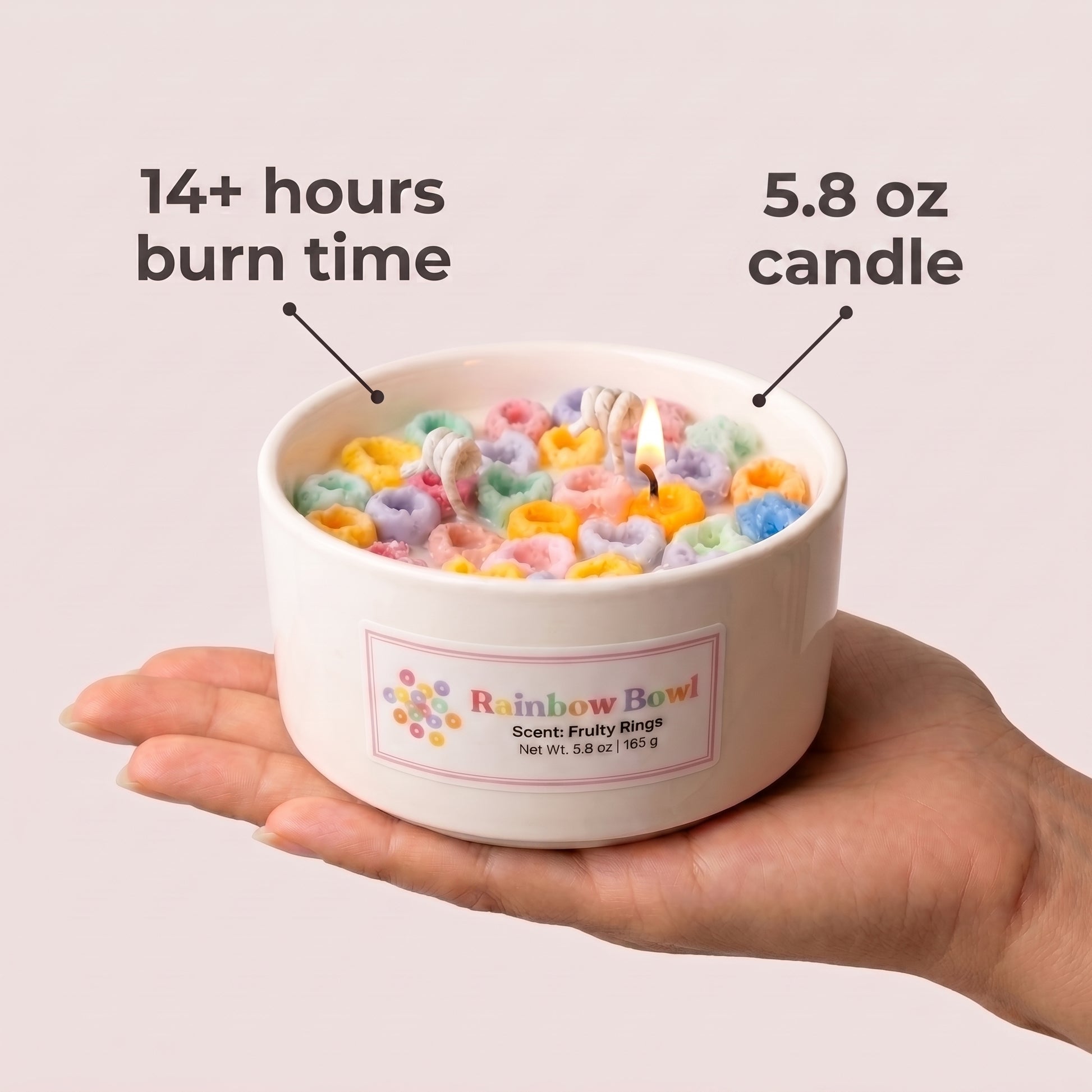 Candle in a bowl with colorful rings held by a hand, labeled with burn time and weight.