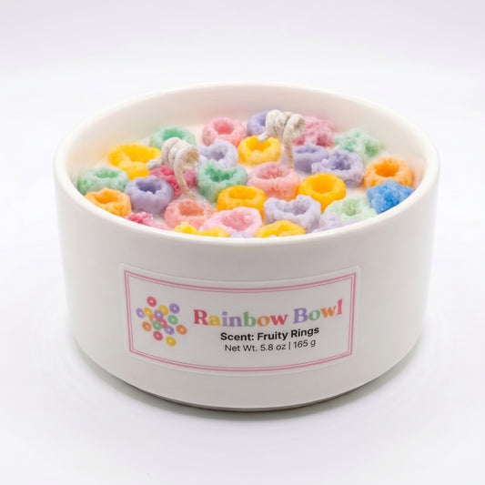 White container filled with colorful cereal-like treats labeled 'Rainbow Bowl' on a white background